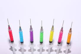 Syringes with coloured fluids